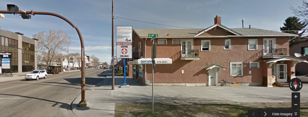 A photo of Ducktoes Computer Repair shop showing the parking slab on the southside of the building.